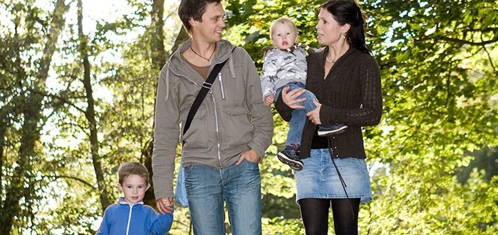 A family walking in green nature