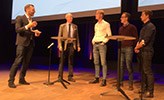 Paneldiskussion, en moderator och fyra deltagare