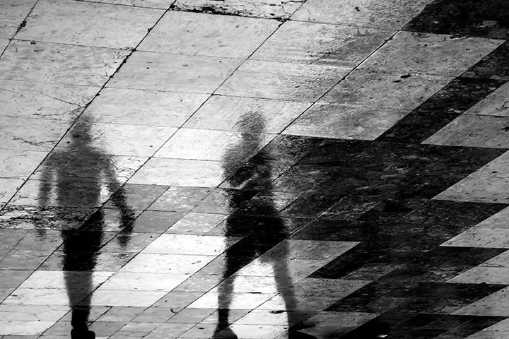  Shadows from two people walking in a square.