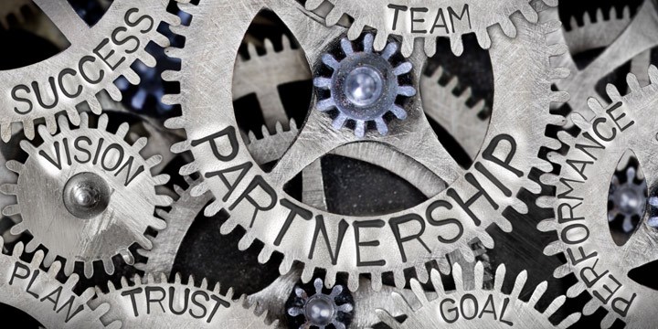 Gears with the words Vision, Partnership, Success, Plan, Trust, Goal, Performance