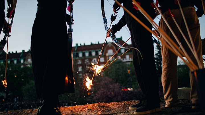 Archers light the bonfire during the Walpurgis Night celebration in front of Örebro Castle.