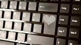 Keyboard with a heart on the return key.