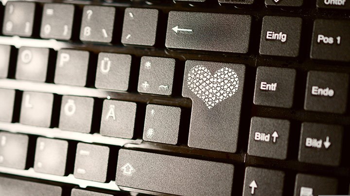 Keyboard with a heart on the return key.