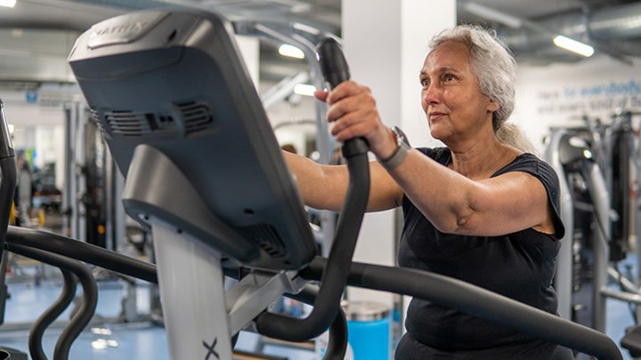 Older woman excersising at the gym.