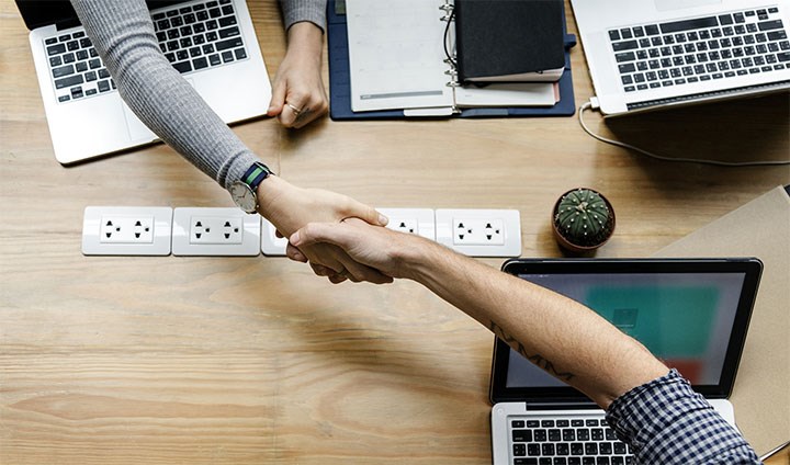 Two people shaking hands.