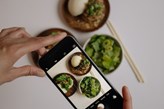 Picture of a mobile taking a photo of food