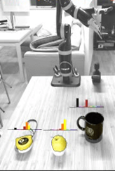 A cup of coffee on a table in a robotics lab