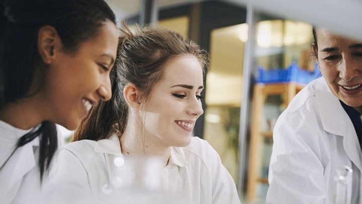 Three people in a lab.