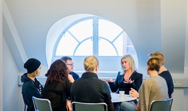 Students sitting with an employer for a round-table discussion.