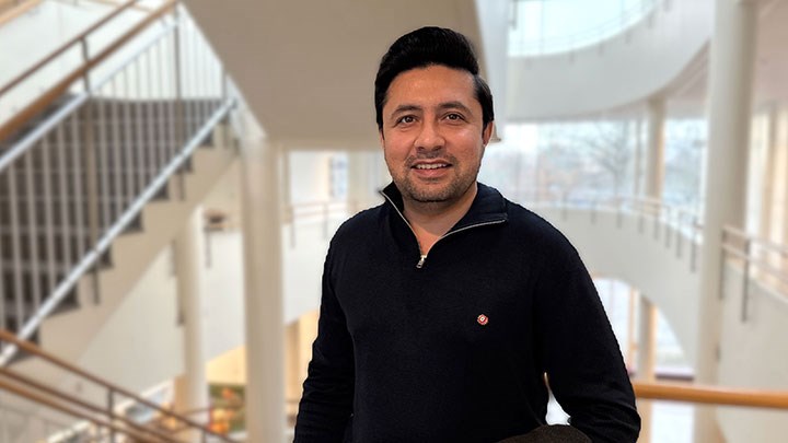 Muhammad Hanif standing in front of a staircase.