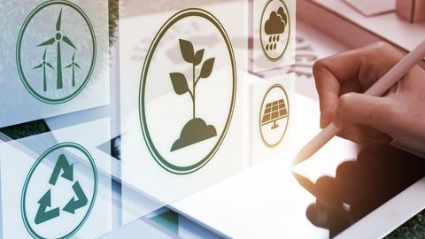 Illustration featuring environmental icons symbolising sustainable development: wind turbines, recycling, plants growing from the soil, rain clouds, and solar panels. On the right is handwriting on a tablet.