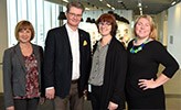 Gun Abrahamsson, Sven Helin, Pia Bro-Nygårdhs and Ida Andersson-Norrie are standing in front of a cafeteria at Örebro University. They all look happy.