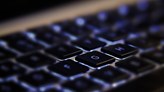 The G key is illuminated on a keyboard.
