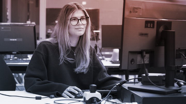 Person working at a computer in a lab environment.