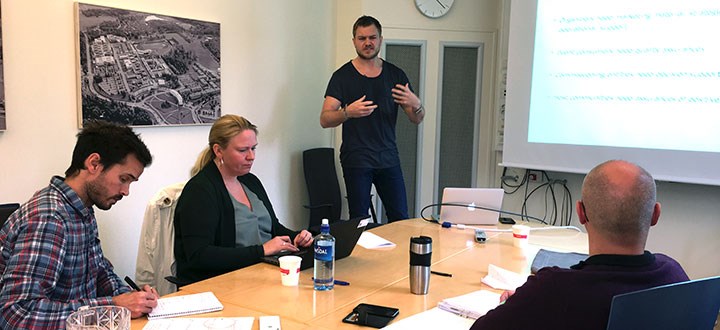 A man speaking at a meeting.