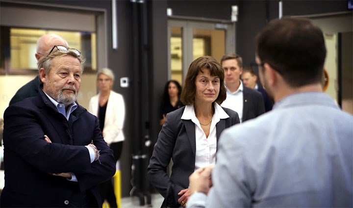 Peter Wallenberg Jr and Sara Mazur listening to AI researcher Andrey Kiselev.