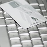 A credit card on a computer key board