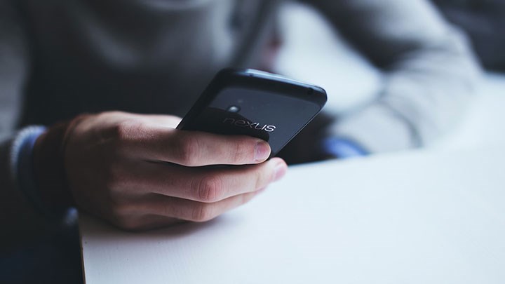 A person holding a mobile phone