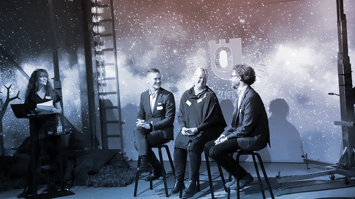 A conference picture of three speakers and one speaker.
