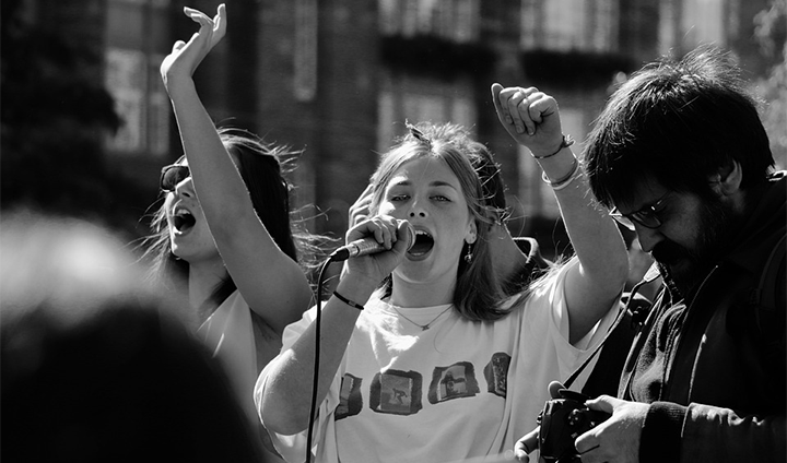  A young woman speaks into a microphone