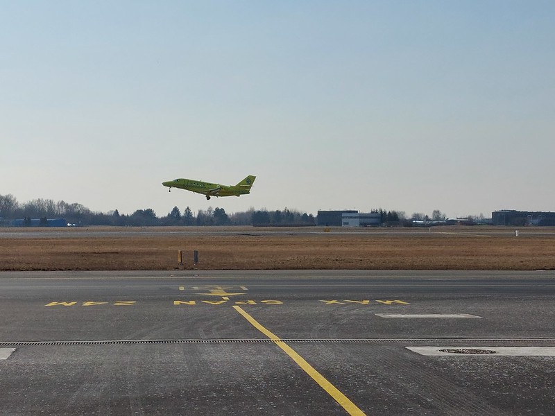Ambulance plane taking off from runway.