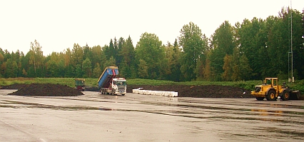 Picture showing biosludge being loaded on a truck.