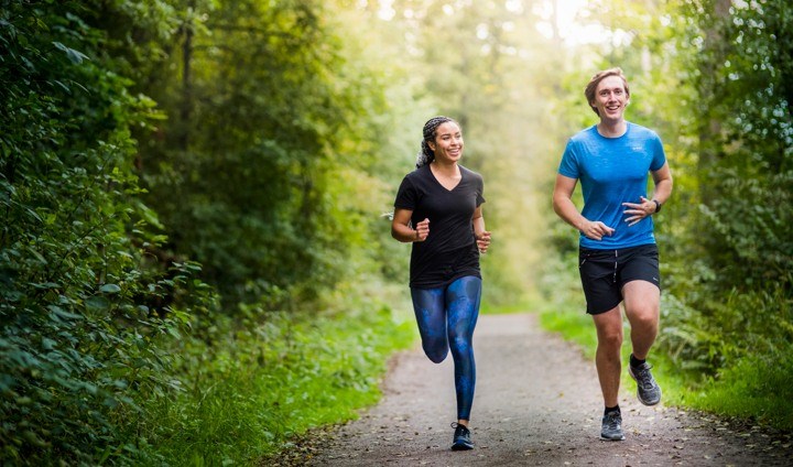 students jogging in the forest