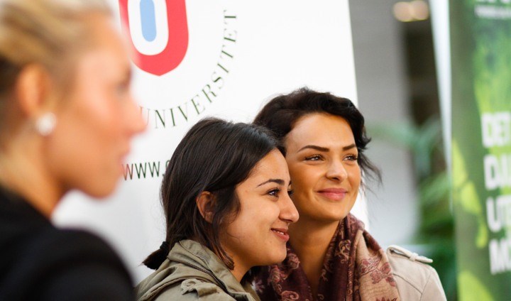 students in front of ORU logo