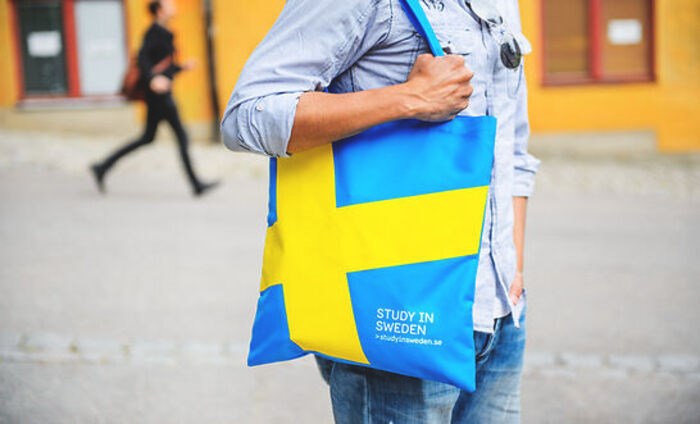 student with Sweden bag