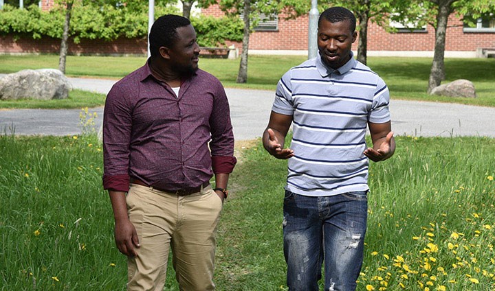 Christopher Bengalie Kabah and Joachim Kouassi n Goran walking and talking.