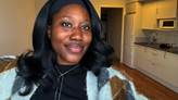 Ayodele in her apartment