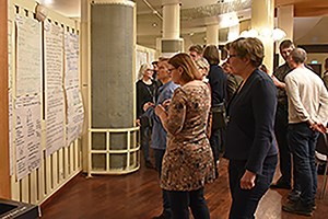 Researchers gathered in front of a wall