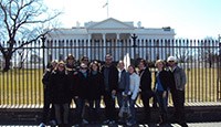 The group in frpn of the White House.