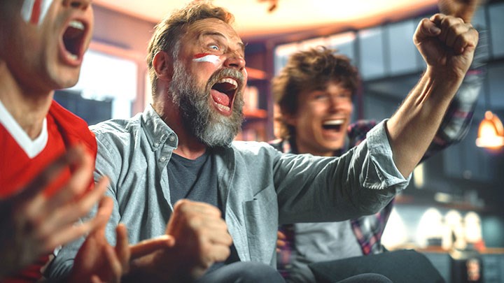 Men shouting and watch sport.