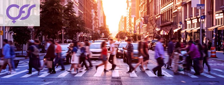 People are crossing a pedestrian crossing.