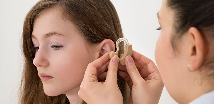 girl with hearing aid