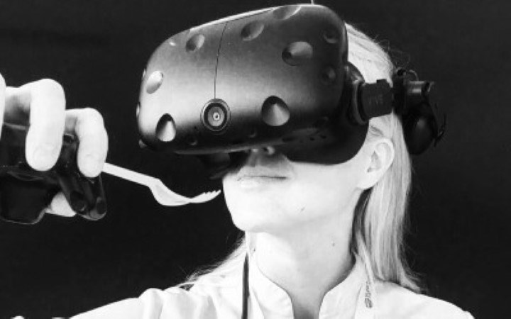 A woman wearing VR glasses.