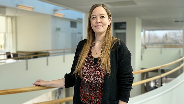A person is holding onto a handrail.