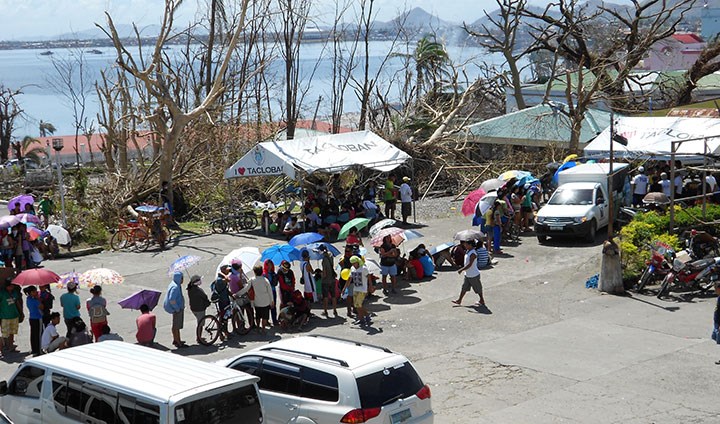 People i line to get their mobiles charged after the typhoon Haiyan in the Philippines in 2013.