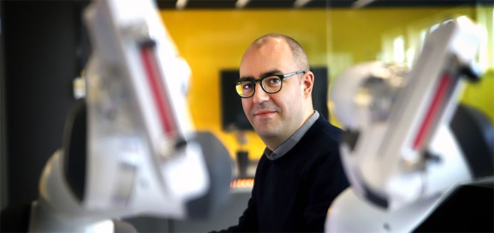 AI researcher Federico Pecora working in the robotics lab.